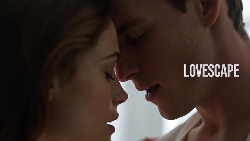 Brunette shares deep open mouth kiss with man in dim bedroom